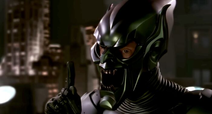 Green Goblin in a dark mask and armor pointing finger, representing famous villains to judge pure evil characters including Lord Voldemort.