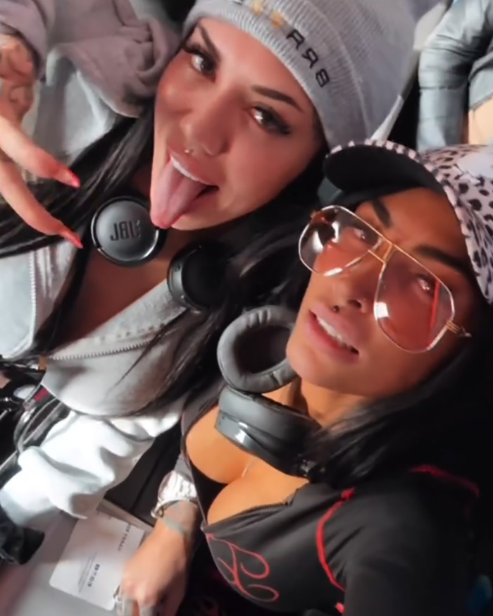 Two adult stars wearing headphones and casual outfits, posing for a selfie inside a plane first-class cabin. Two adult stars wearing headphones and casual outfits, posing for a selfie inside a plane first-class cabin.