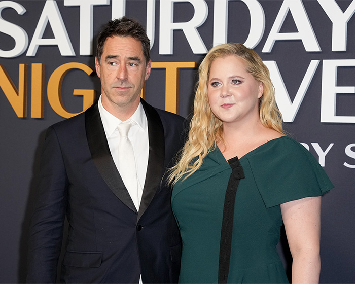 Amy Schumer and her husband at an event amid divorce filing and backlash over bikini photos. Amy Schumer and her husband at an event amid divorce filing and backlash over bikini photos.