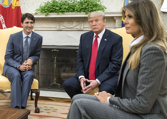 Donald Trump and Melania Trump seated during a formal meeting, highlighting Barron Trump paternity conspiracy discussion. Donald Trump and Melania Trump seated during a formal meeting, highlighting Barron Trump paternity conspiracy discussion.