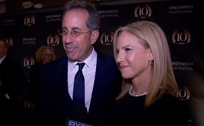 Celebrity couple attending Greenwich Film Festival, dressed formally, captured during coverage of celebrity infidelity scandals.