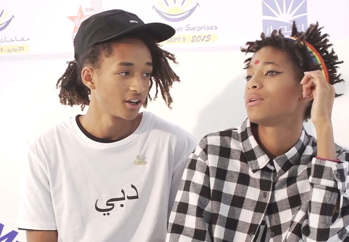 Two celebrities in casual outfits at a public event showing moments out of touch with reality.