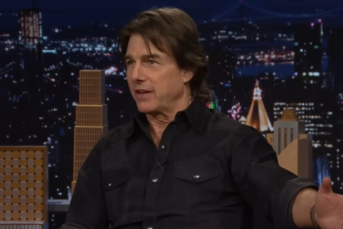 Male celebrity in black shirt speaking on a late night talk show about moments celebrities were out of touch with reality