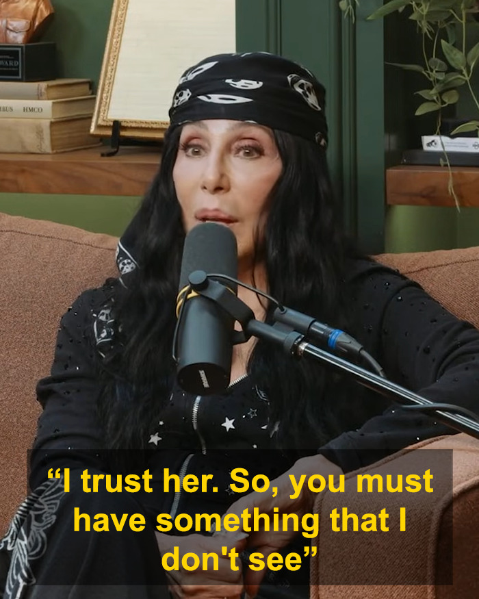 Cher speaking into a microphone on a couch during podcast, Cher comment Kristen Bell Dax Shepard marriage