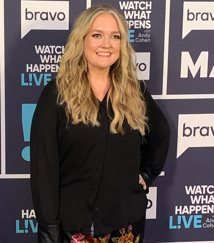 Woman with long blonde hair smiling at a Bravo event backdrop, related to Ryan Reynolds manipulative email leak topic. Woman with long blonde hair smiling at a Bravo event backdrop, related to Ryan Reynolds manipulative email leak topic.