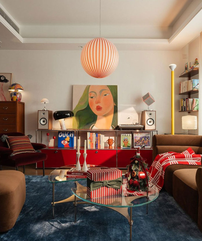 Modern living room featuring cool interior design ideas with colorful art, cozy seating, and stylish decor elements.