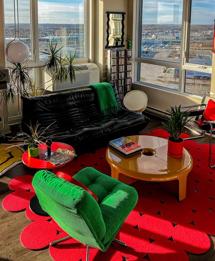 Modern living room with colorful furniture and plants showcasing cool interior design ideas for a stylish home makeover.