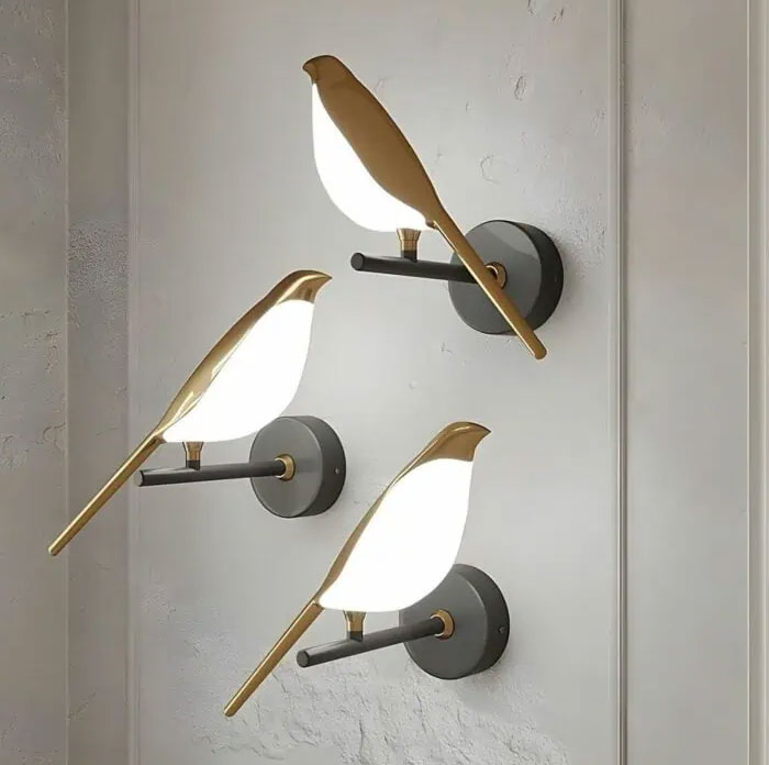 Modern bird-shaped wall lights mounted on a textured wall showcasing cool interior design ideas for home decor.