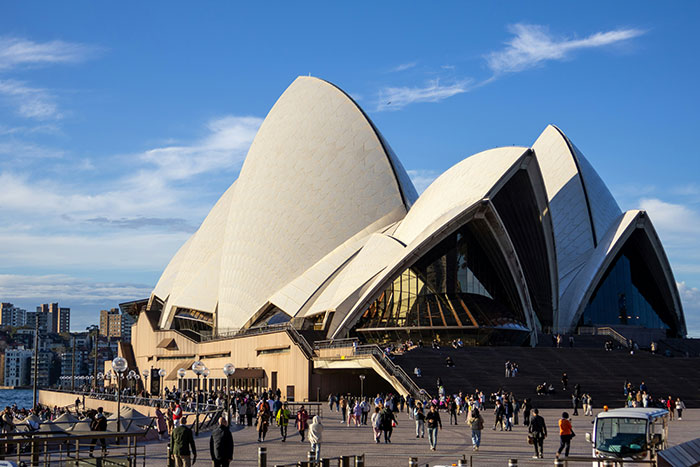 Sydney Opera House at sunset with crowds on the forecourt, travel scene, Tokyo