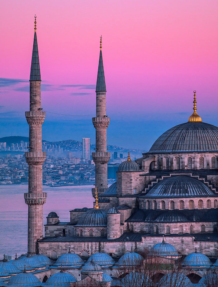Istanbul mosque and minarets at pink dusk over the Bosphorus, Tokyo