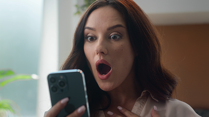 Woman shocked by text message on phone, reacting to dad’s mistress revealing months-long affair on New Year's Eve. Woman shocked by text message on phone, reacting to dad’s mistress revealing months-long affair on New Year's Eve.