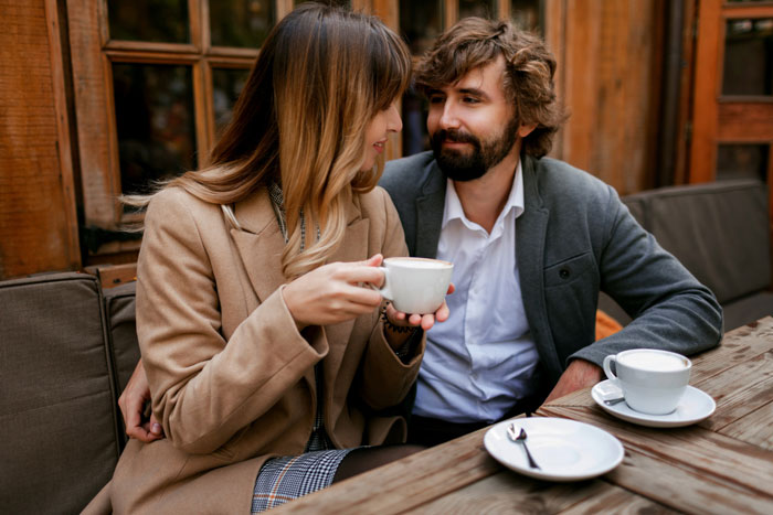 Couple on a second date at a coffee shop, highlighting recovering alcoholic avoiding bars during their outing. Couple on a second date at a coffee shop, highlighting recovering alcoholic avoiding bars during their outing.
