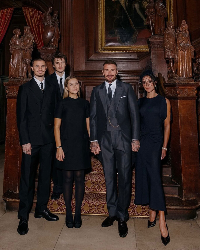 David Beckham with family members dressed formally, posing in an ornate room amid ongoing family rift discussions. David Beckham with family members dressed formally, posing in an ornate room amid ongoing family rift discussions.