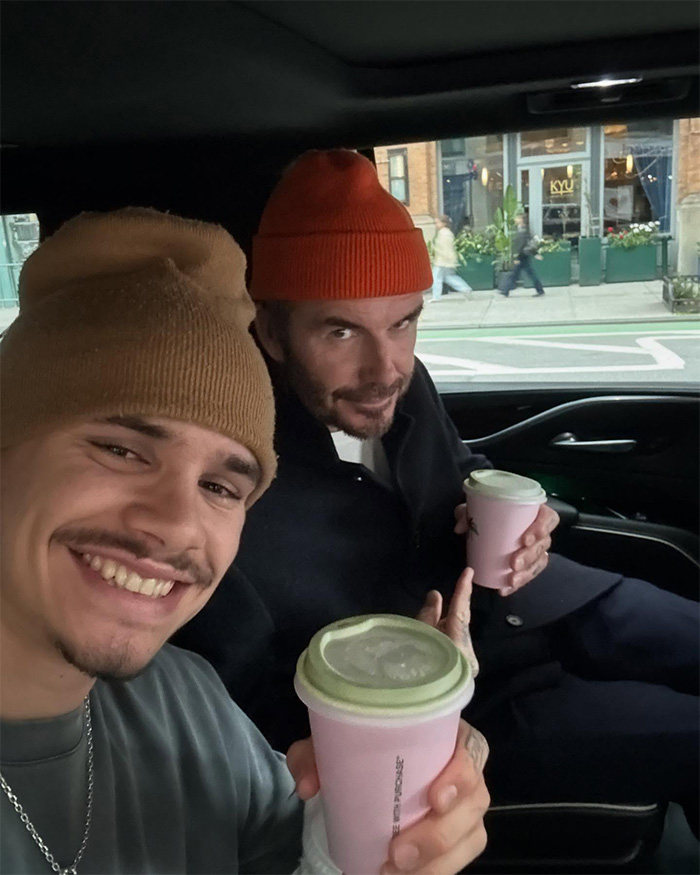 David Beckham and his son smiling and holding drinks inside a car amid ongoing family rift crisis.