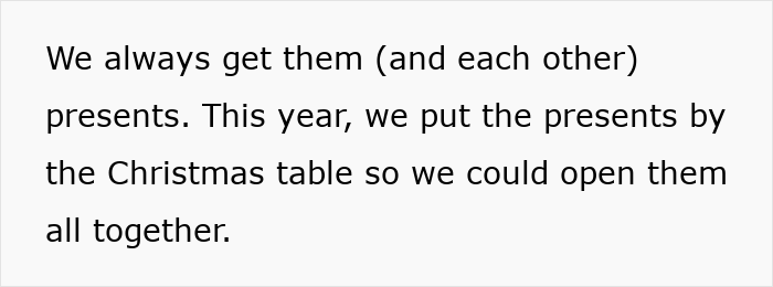 Text on a white background discussing getting presents and opening them together by the Christmas table. Text on a white background discussing getting presents and opening them together by the Christmas table.