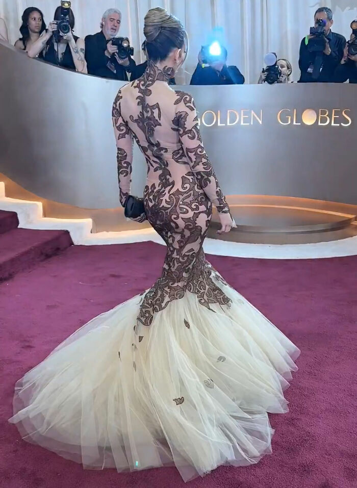 Jennifer Lopez in an intricate gown at the Golden Globes amid backlash over her alleged rude interaction.