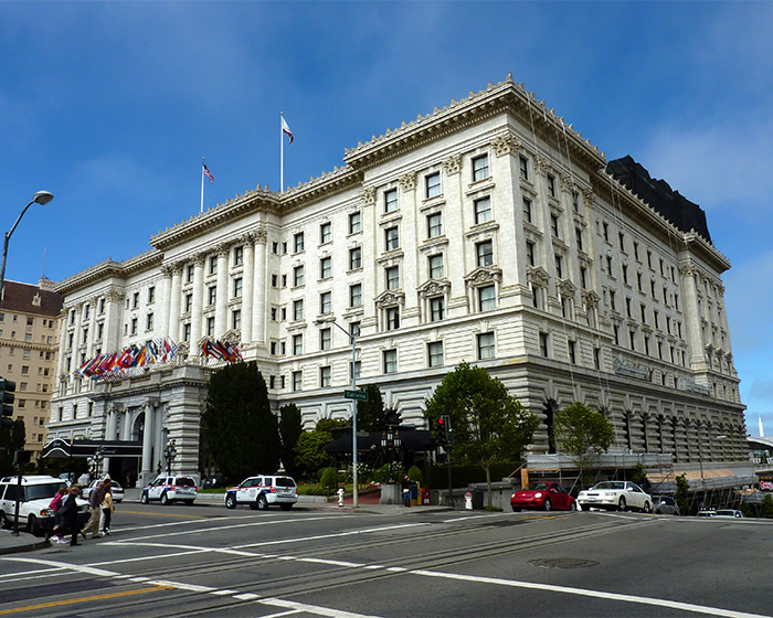 Historic multi-story building with flags outside, city street, and pedestrians, illustrating mystery deepens surrounding Victoria's passing. Historic multi-story building with flags outside, city street, and pedestrians, illustrating mystery deepens surrounding Victoria's passing.