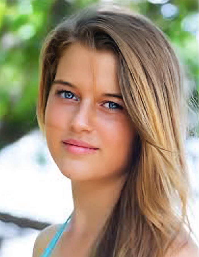 Young woman with long blond hair outdoors, related to fate of waitress and Swiss ski resort fire investigation.