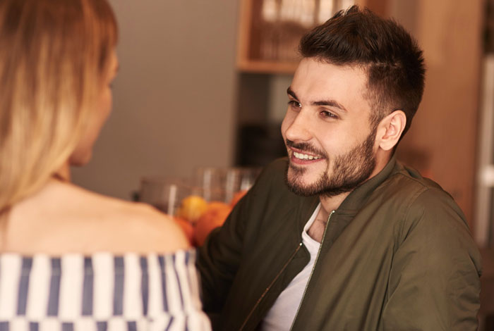Man and woman in a casual setting, engaging in conversation about boundaries and relationship challenges. Man and woman in a casual setting, engaging in conversation about boundaries and relationship challenges.