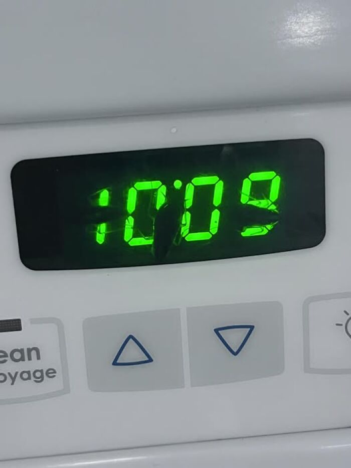 Woke up to a stove clock showing warped green 10:09 on a white control panel with up/down buttons