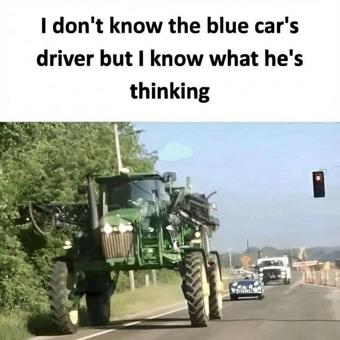 Funny meme showing a large green tractor next to a blue car at a stoplight, capturing randomness and humor.
