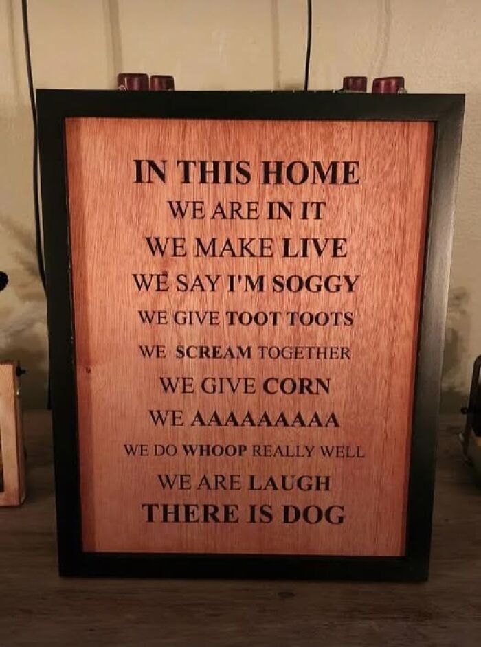 Wooden framed sign with confusing funny phrases that break the brain trying to understand what is read.