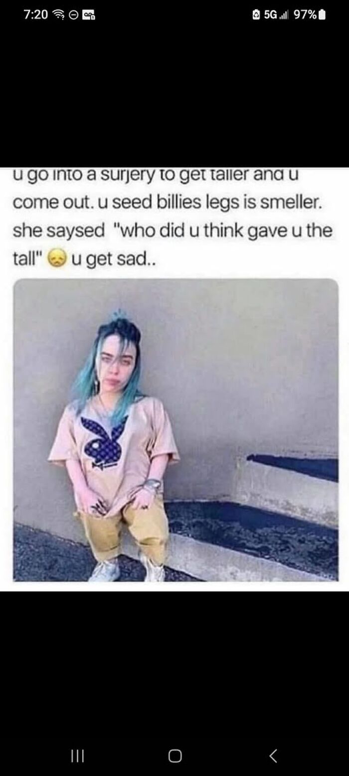 Person with teal hair and oversized clothes sitting against a wall, meme text confusing readers included to break brain understanding.