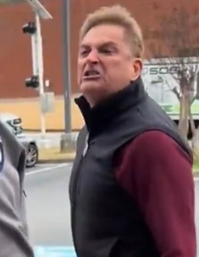 Angry man resembling male version of Karen during a public meltdown on a city street with blurred background. Angry man resembling male version of Karen during a public meltdown on a city street with blurred background.