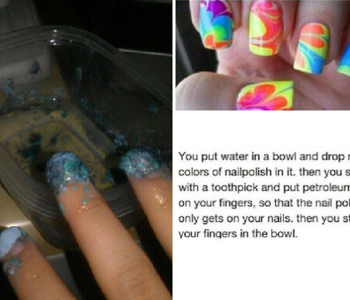 Fingers covered in nail polish fail during a DIY water marble nail art attempt with polish dripping unevenly.