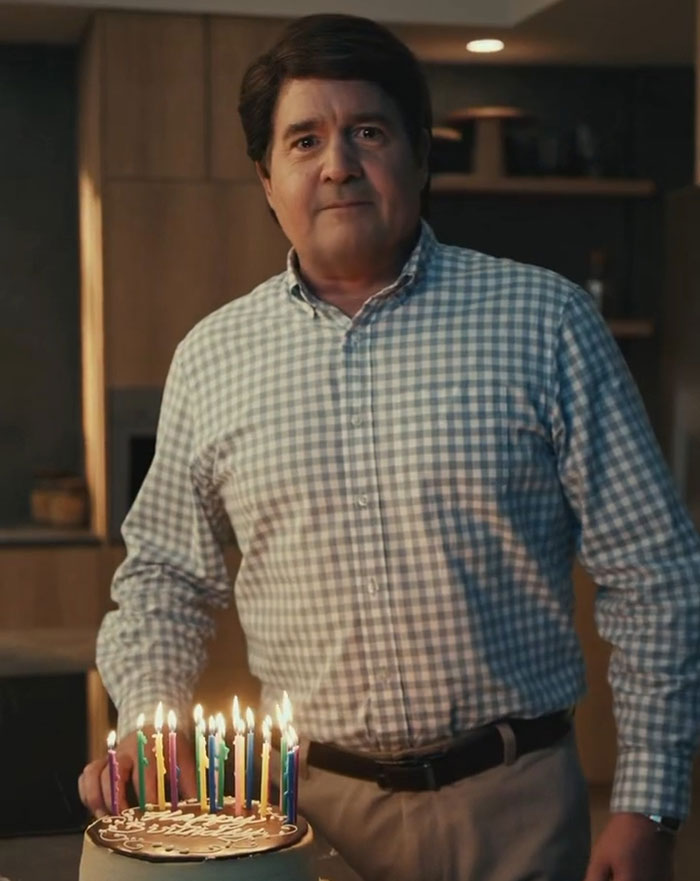 Man celebrating 58th birthday with cake and candles, representing Guy Fieri 58th birthday glow-up and new hairstyle. Man celebrating 58th birthday with cake and candles, representing Guy Fieri 58th birthday glow-up and new hairstyle.