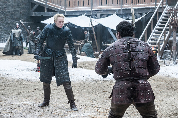 Medieval armored individuals sparring in a Game of Thrones setting, relating to Ser Duncan the Tall fan theory.