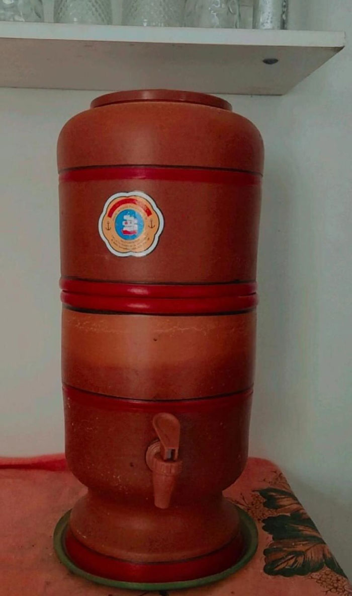 Traditional clay water filter with tap, a unique household item found in certain countries and regions only
