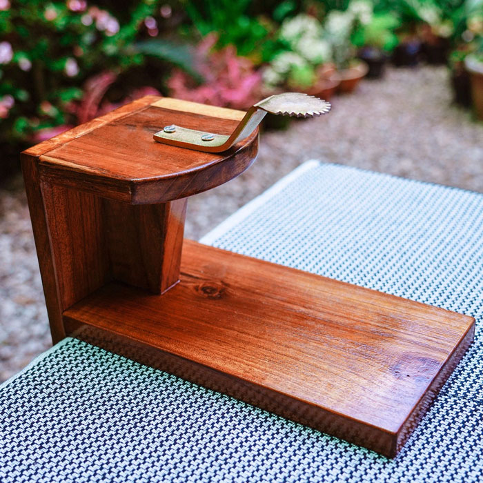 Unique household item made of wood with a metal lever, shared by people from different countries worldwide.