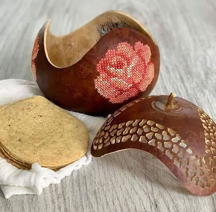 Decorative household items with unique cultural patterns on a table, representing rare items found in specific countries.