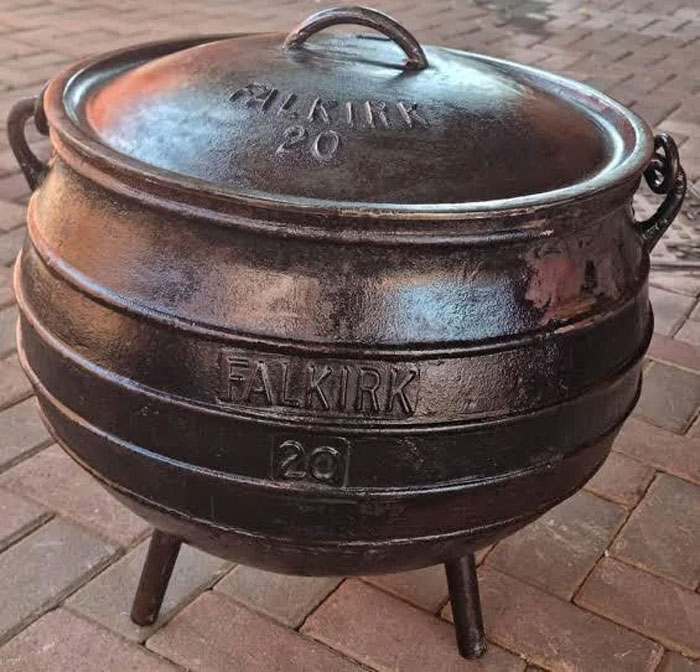 Cast iron potjie pot on three legs, a unique household item found in specific countries only.