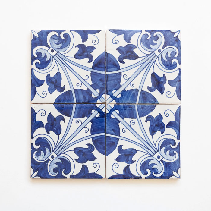 Blue and white decorative ceramic tiles featuring traditional patterns, a unique household item from certain countries.