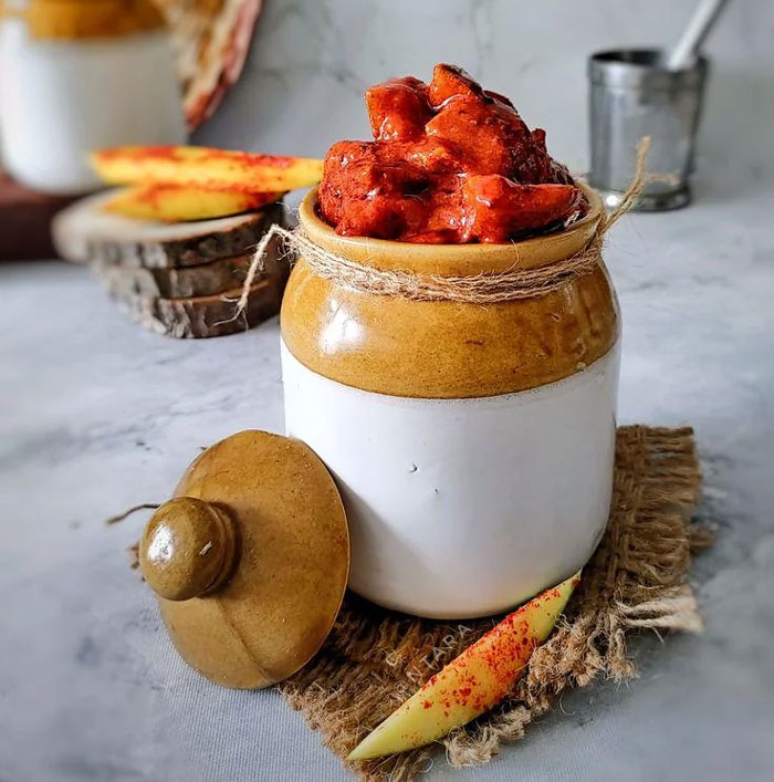 Ceramic jar with regional spicy mango pickle, a unique household item found in some countries only.