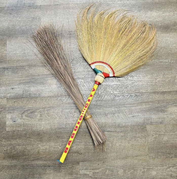 Traditional household brooms unique to certain countries made from natural fibers for sweeping floors efficiently.