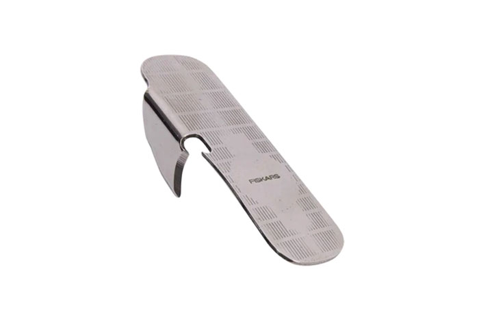 Metal household item with a unique hook design shared by people from different countries in a collection of rare items.