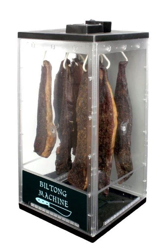Biltong machine hanging cured meat inside a transparent box, a unique household item in certain countries.