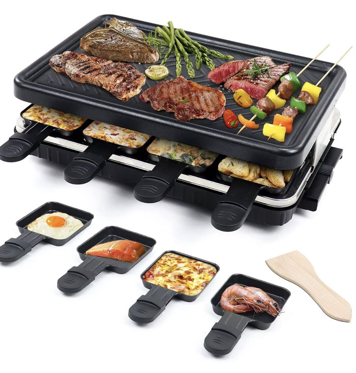 Electric tabletop grill with individual pans cooking various foods, a unique household item shared by 100 people worldwide.
