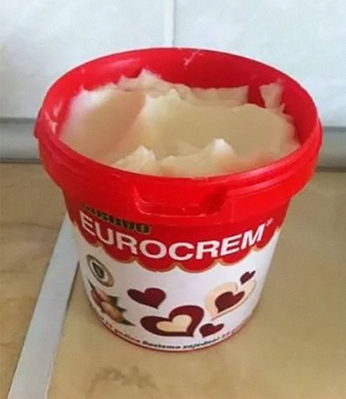 Red container of Eurocrem spread with a creamy texture, a unique household item from a specific country.