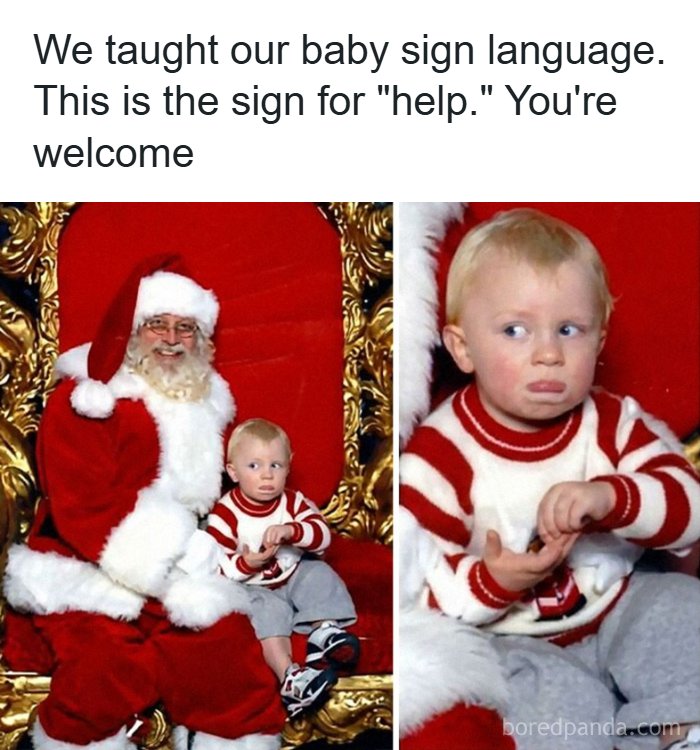 Toddler showing sign language for help while sitting with Santa Claus, capturing a funny moment for memes with randomness.
