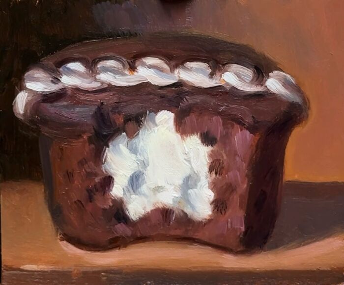 Oil painting of a bitten chocolate cupcake with cream, showcasing modern-day fast food through a classical art lens.