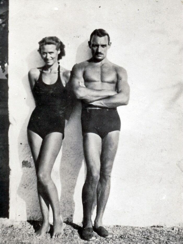 Vintage black and white photograph of a man and woman in swimsuits, capturing a moment in the history of humanity.