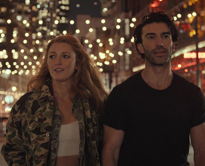 Blake Lively and Ryan Reynolds walking together at night with city lights, related to Justin Baldoni case texts. Blake Lively and Ryan Reynolds walking together at night with city lights, related to Justin Baldoni case texts.