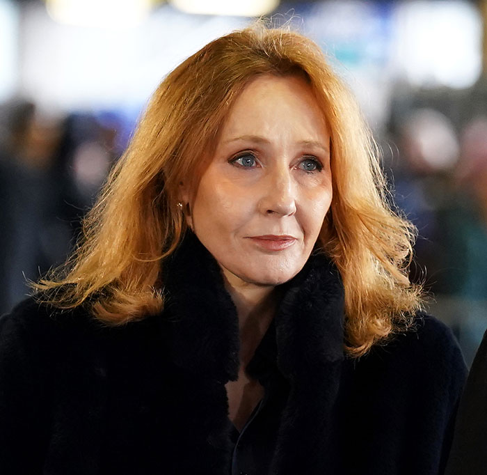J.K. Rowling at an event, wearing a black coat, with serious expression amid media coverage of trans chef controversy. J.K. Rowling at an event, wearing a black coat, with serious expression amid media coverage of trans chef controversy.