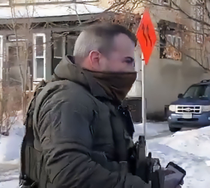 Father of ICE agent pictured outside a residential area wearing tactical gear and a face covering during winter. Father of ICE agent pictured outside a residential area wearing tactical gear and a face covering during winter.