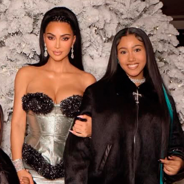 Kim Kardashian with daughter North West at an event, sparking discussions over North West interacting with adults.