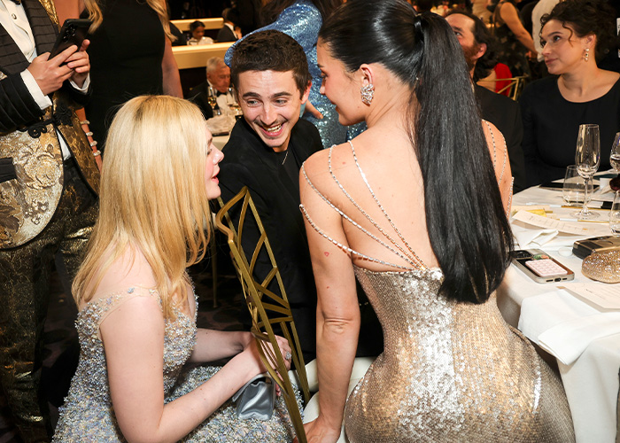 Kylie Jenner at Golden Globes in sparkly dress, sparking debate over her unusual seat arrangement at the event. Kylie Jenner at Golden Globes in sparkly dress, sparking debate over her unusual seat arrangement at the event.